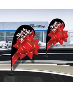 Happy Holidays Red Bow Holiday 3-D Mini Clip-On Paddle Flag Kits on vehicles at an auto dealership