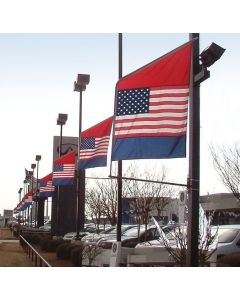 Double Sided Motion Bracket Flag on poles at an auto dealership