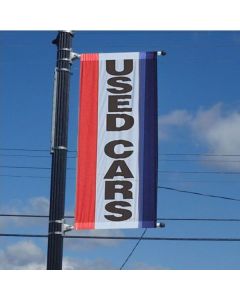 Single-Sided Message Drape Flag with Sleeves on pole over an auto dealership