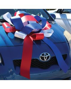 30" Giant Showroom Bows - Patriotic Red, White, Blue on vehicle hood at an auto dealership