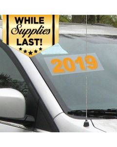 Rectangle Model Years Fluorescent on Transparent on vehicle windshield in an auto dealer lot